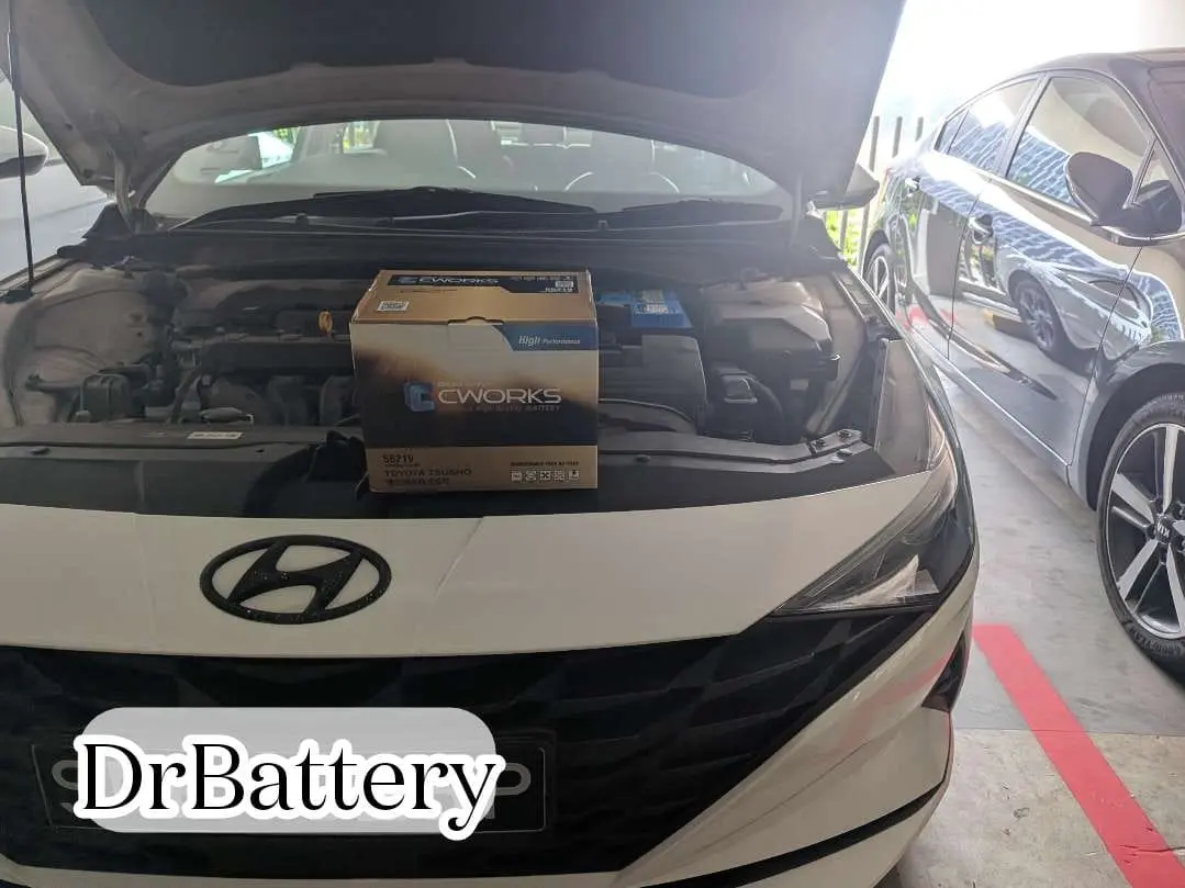 Hyundai with an open bonnet and replacement battery during onsite service